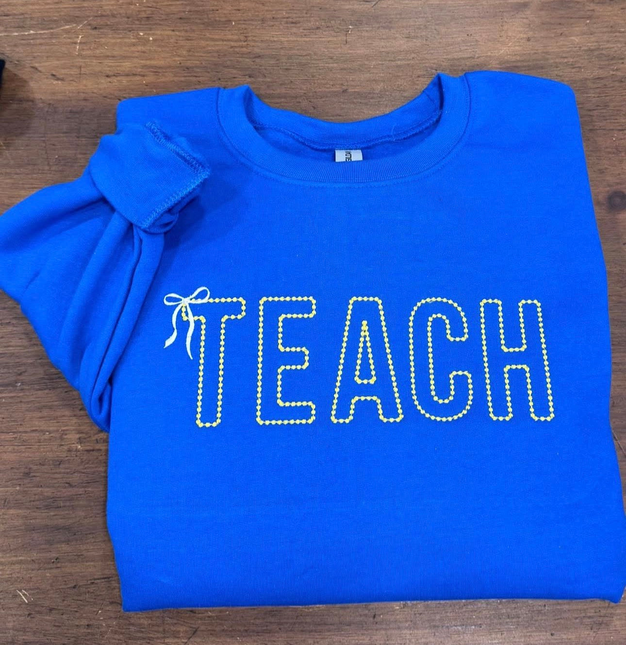 TEACH Outline - Embroidered Royal Blue Sweatshirt